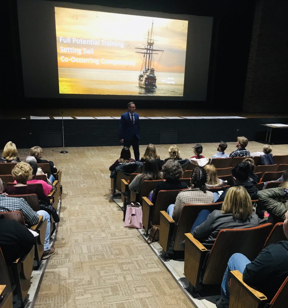 Ted presenting a Full Potential Training co-occurring competency workshop to a full auditorium